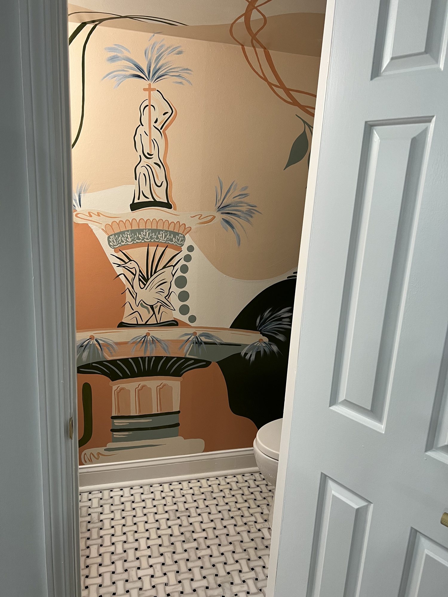 Bath with botanical mural wall