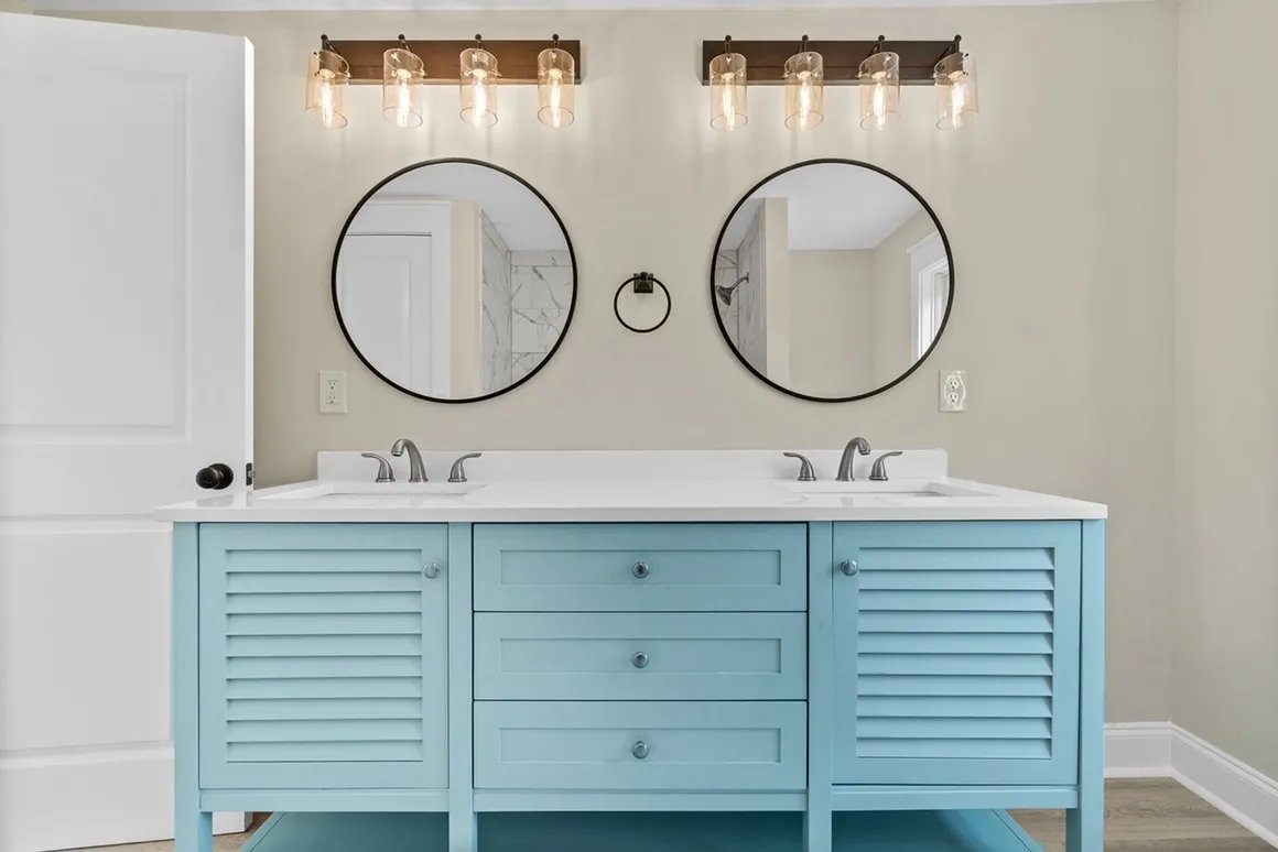 Double vanity with blue cabinets