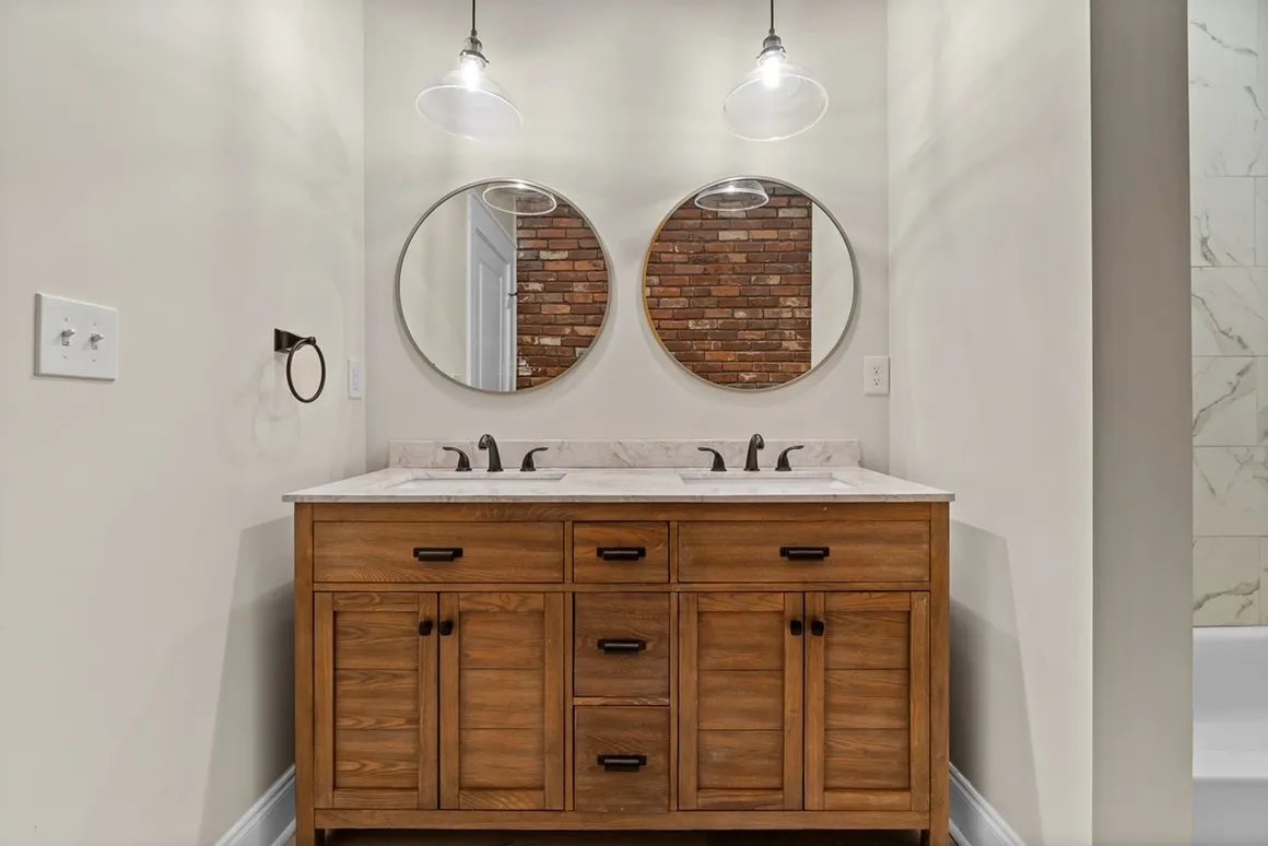 Wood double vanity with round mirrors