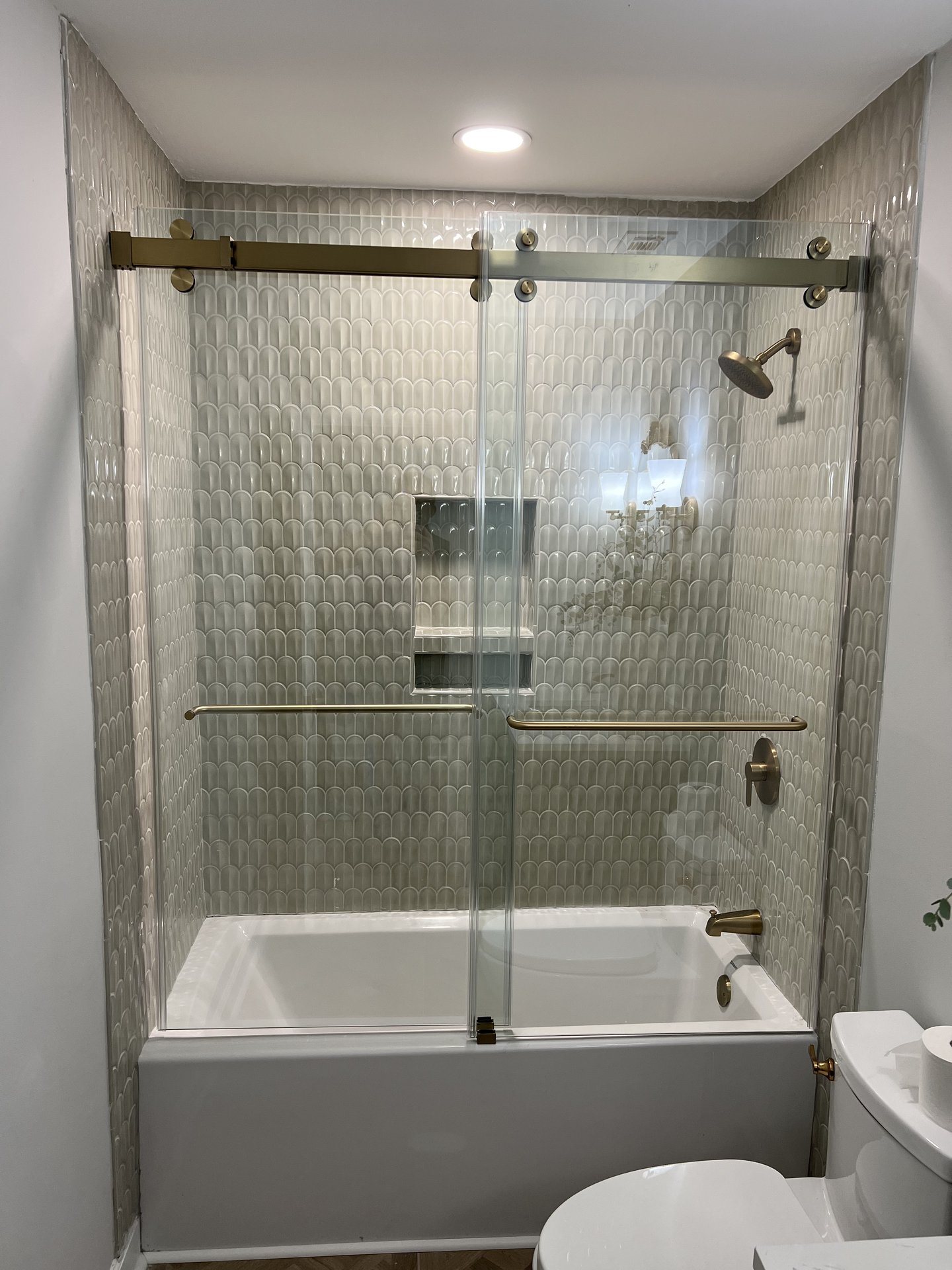 Bath with brass fixtures and marble