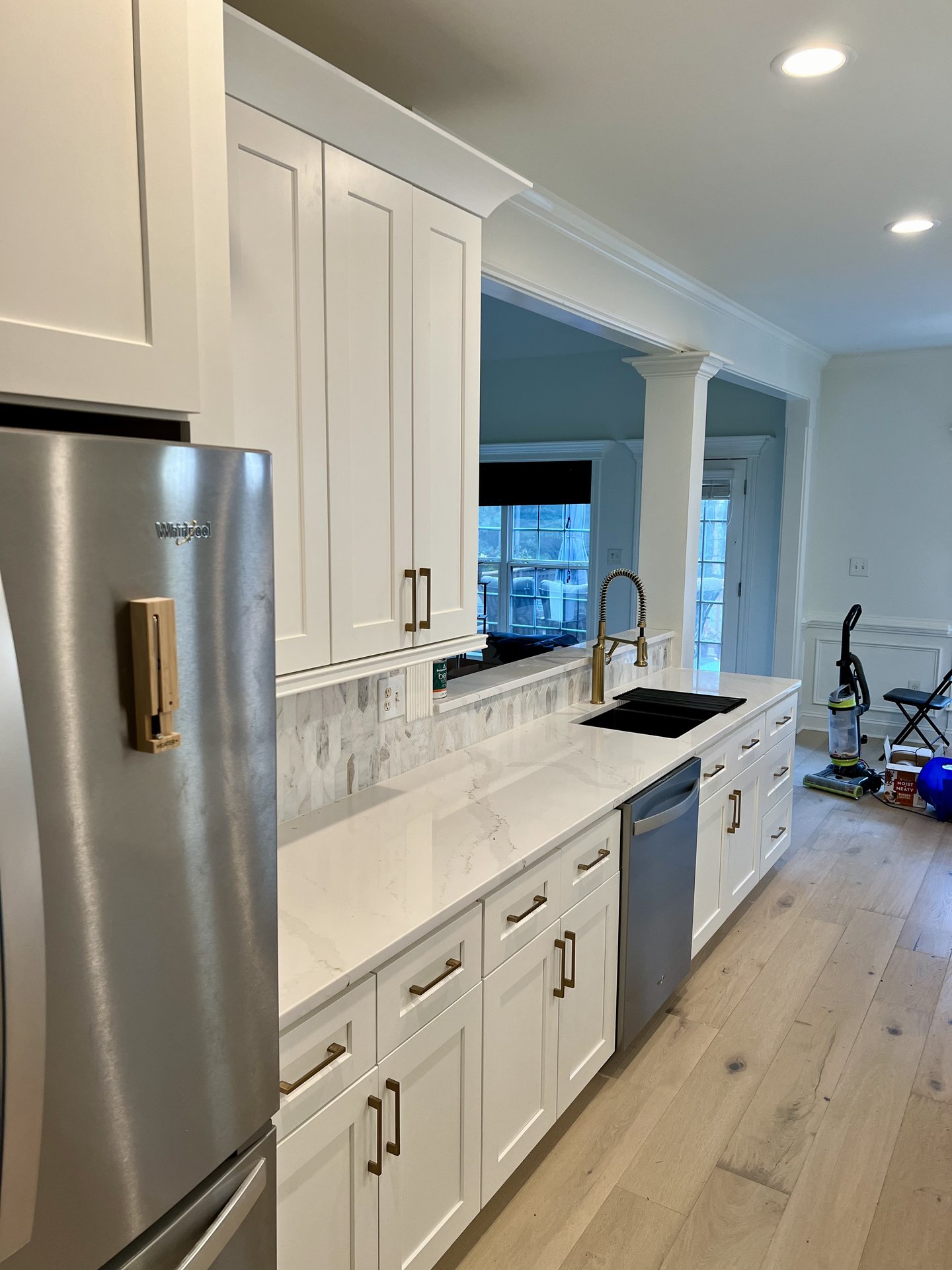White kitchen with marble backsplash